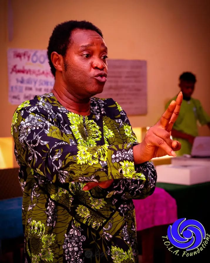 Deaf and Proud, Dr. Odutola Ayorinde Odusanya addressing the audience at Wesley School in Sign Language in Nigeria.
Photo by T.O.L.A