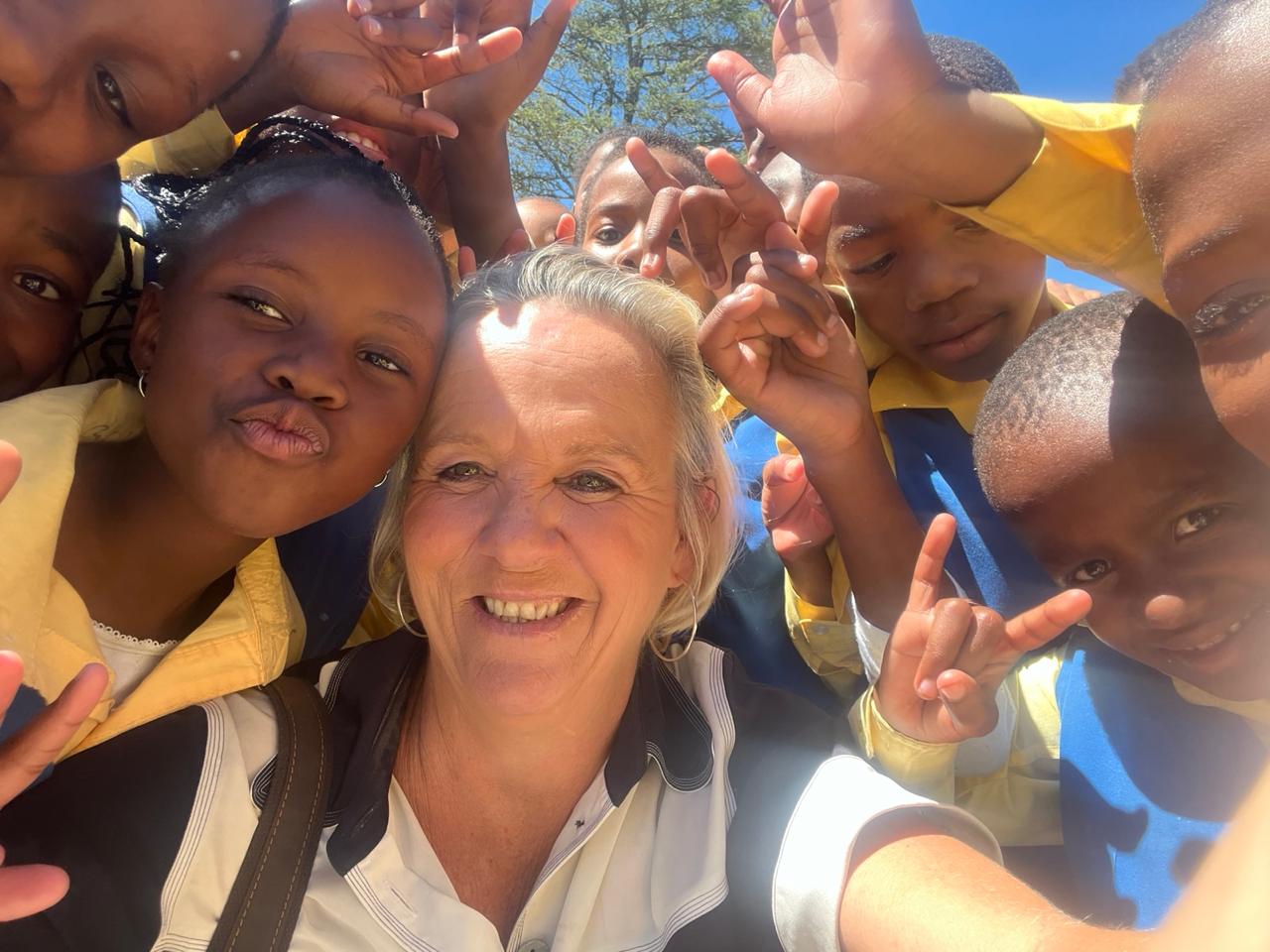 Ingrid Parkin with school children as she continues to advocate for quality Deaf education. Picture: Supplied